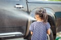 Asian little girls helping parent washing a car Royalty Free Stock Photo