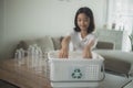 Asian Little Girls Separating Recycle Plastic Bottles to Trash Bin Royalty Free Stock Photo