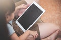 Asian little kid girl and her family sitting and using digital t Royalty Free Stock Photo