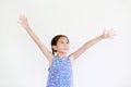 Asian little kid girl with pigtail hair standing and open wide arms with looking up isolated on white background Royalty Free Stock Photo