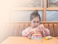 Asian little kid girl play the edible toy