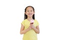 Asian little kid girl smiling with broken tooth eating ice cream cone isolated on white background Royalty Free Stock Photo