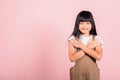 Asian little kid 10 years old doing grateful gesture and closed eyes Royalty Free Stock Photo