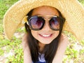 Asian long black hair girl is wearing black sunglasses, straw ha Royalty Free Stock Photo