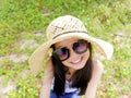 Asian long black hair girl is wearing black sunglasses, straw ha Royalty Free Stock Photo