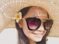 Asian long black hair girl is wearing black sunglasses, straw ha Royalty Free Stock Photo