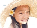 Asian long black hair girl is wearing straw hat and white flower Royalty Free Stock Photo