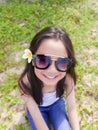 Asian long black hair girl is wearing black sunglasses and white Royalty Free Stock Photo
