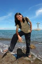 Asian long-haired boy on tropical beach