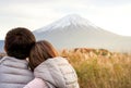 Asian lovely couple in love feeling with fuji mountain in evening light background and copy space. Use for love and couple artwort