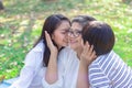 Asian lovely young daughter and grandson kiss happy and healthy senior woman or pleasure grandmother in moment of beautiful love i Royalty Free Stock Photo