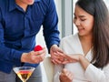 The asian lover man gave ring proposing to marry to his woman from red box Royalty Free Stock Photo