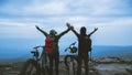 Asian lover women and men Travel Nature. Travel relax ride a bike Wilderness in the wild. Standing on a rocky cliff. travel