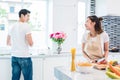 Asian lovers or couples cooking so funny together in kitchen wit Royalty Free Stock Photo