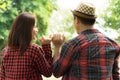 Asian lovers holding hands together in park