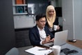Asian malay couple working together at home Royalty Free Stock Photo
