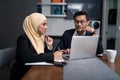 Asian malay couple working together at home Royalty Free Stock Photo