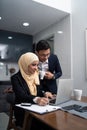 Asian malay couple working together at home Royalty Free Stock Photo