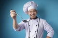 Asian Male Chef Making Soup, Chef Holding Kitchen Tool Ladle Royalty Free Stock Photo