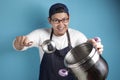 Asian Male Chef Making Soup, Chef Holding Kitchen Tool Pot and Ladle Royalty Free Stock Photo