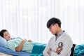 Asian male doctor Sitting and close his eyes on the chair, he watched the symptoms of the patients