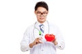 Asian male doctor with syringe and red heart Royalty Free Stock Photo