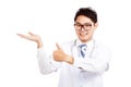 Asian male doctor thumbs up with copy space on his palm hand