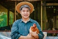 Asian male farmers raise chicken eggs.