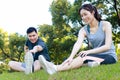 Asian male and female couple Exercise in the outdoor park in the morning. Royalty Free Stock Photo