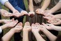 Asian Male and Female raise up right hand and then hold text sharing together in the circle group at garden