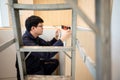 Asian male furniture assembler using spirit level tool Royalty Free Stock Photo