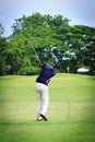 Asian Male golf player on Golf course Royalty Free Stock Photo