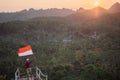 Asian male with indonesian flag celebrating independence day Royalty Free Stock Photo