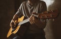 Asian guy playing acoustic guitar close up Royalty Free Stock Photo