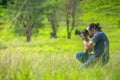 2018-09-12 Asian Male Photographer Taking a Nature Landscape Picture in the forest in Ranong Province, Thailand