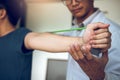 Asian male physical therapist descent working and helping to protect the hands of patients with patient doing stretching exercise