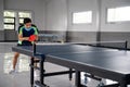 Asian male ping pong player ready to receive service ball Royalty Free Stock Photo