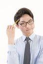 Asian male student with a pencil Royalty Free Stock Photo