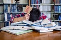 Asian male students are tired and stressed with reading a lot to prepare for the exam Royalty Free Stock Photo