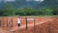 Asian male tourist photographer in VangVieng Royalty Free Stock Photo