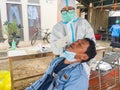 an asian male worker doing a rapid antigen test, corona virus swab test, December 30 2021, Bontang, East Kalimantan, Indonesia