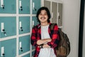 Asian male young student carrying backpack Royalty Free Stock Photo