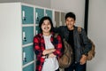 Asian male young student carrying backpack Royalty Free Stock Photo