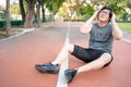 Asian man athlete feeling dizzy while doing exercise