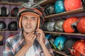 Asian man attaches the strap buckle while wearing the helmet Royalty Free Stock Photo