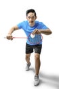 Asian man with badminton racket holding shuttlecock and ready in serve position Royalty Free Stock Photo