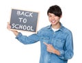 Asian man with the blackboard showing phrases of back to school Royalty Free Stock Photo