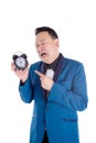 Man in blue suit holding clock and crying over white