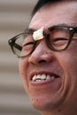 Asian Man in Broken Glasses