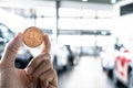 Asian man business holding tecnology bit coin in blurry office background. For business people, finance, lifestyle and ethereum or Royalty Free Stock Photo